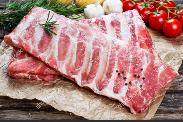 stock-photo-raw-ribs-with-a-rosemary-and-vegetables-on-crumpled-paper-373844560.jpg
